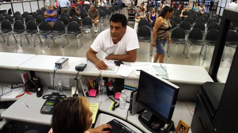 Man standing at the DMV.